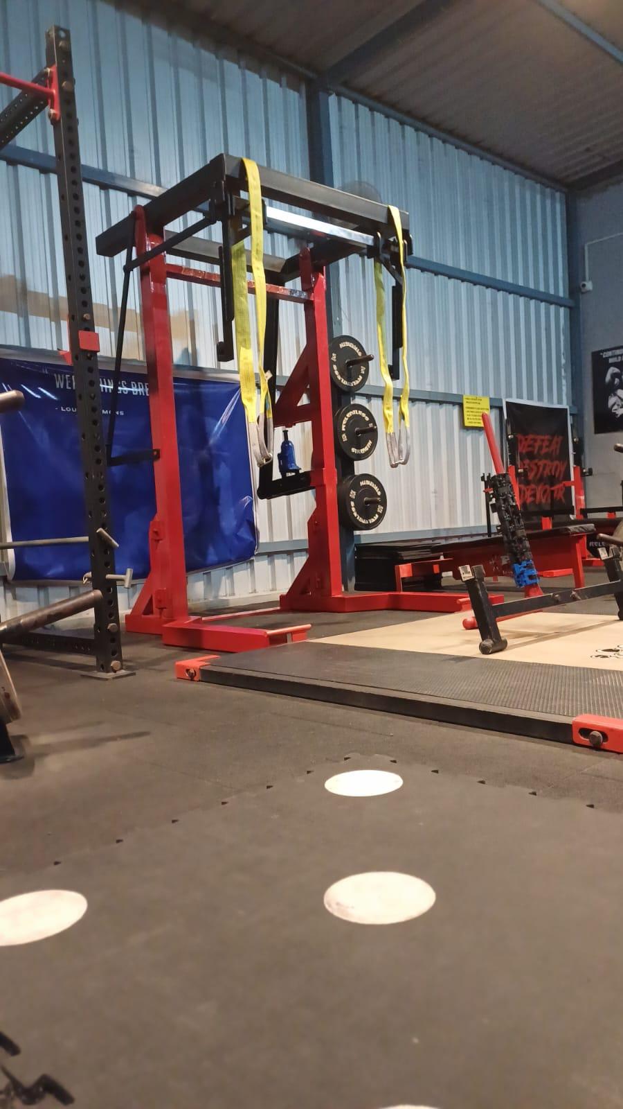 Heavy-Duty Red Power Rack with Calibrated Plates